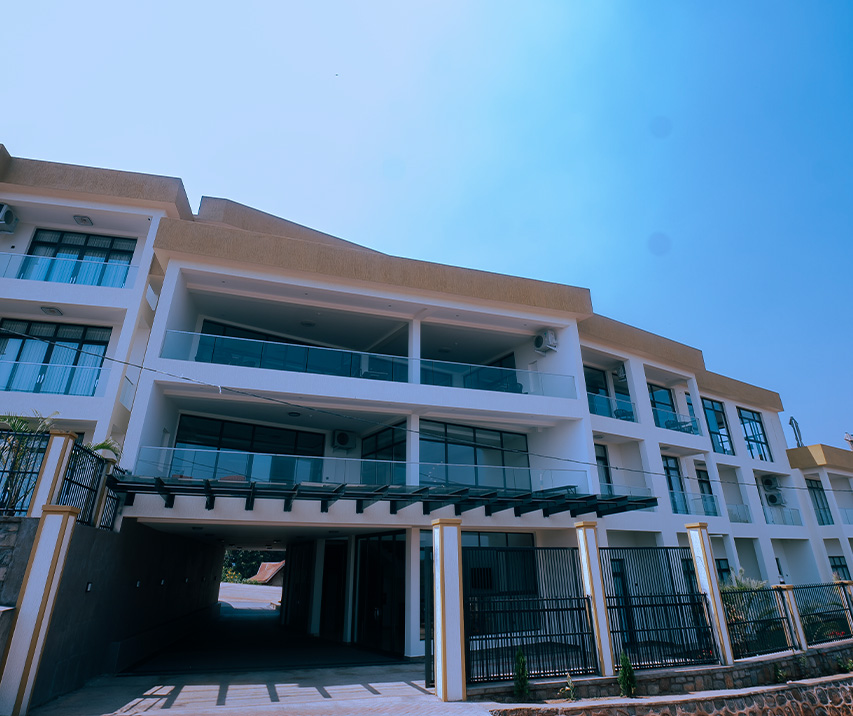 Exterior view of ESSENCIA Kivu Hotel in Rusizi, Rwanda, showcasing its modern architecture and lakeside location.